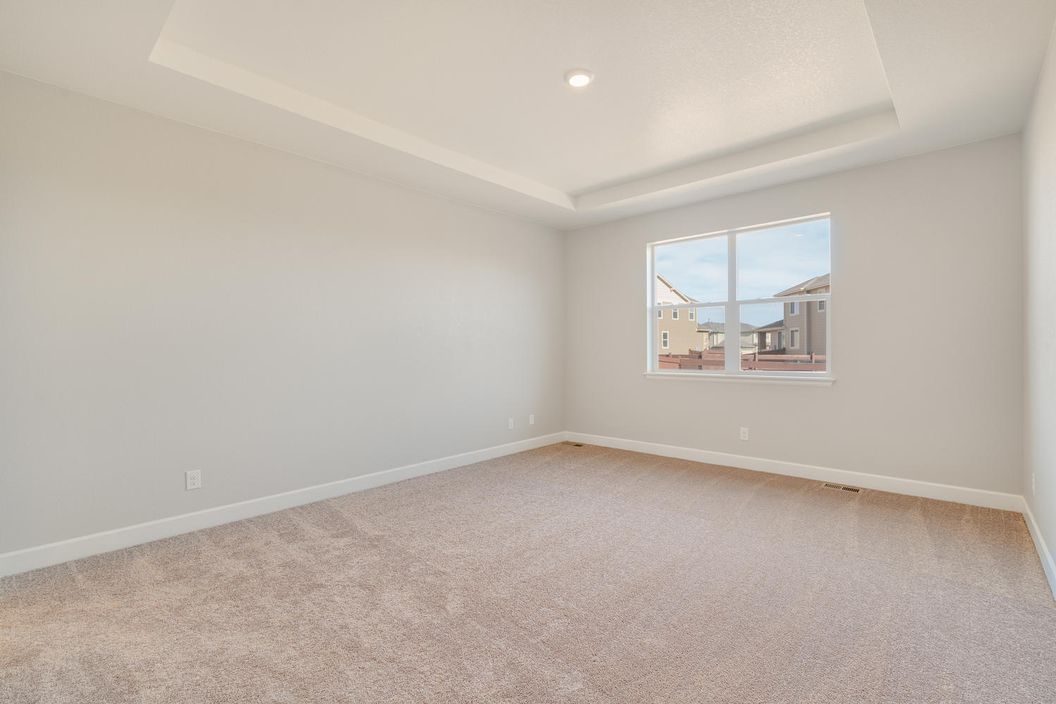 bedroom with a window and carpet floor