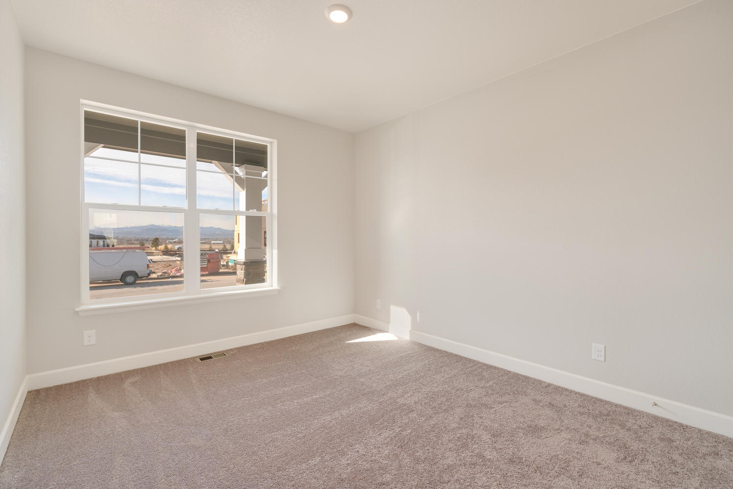 bedroom with a window and carpet floor