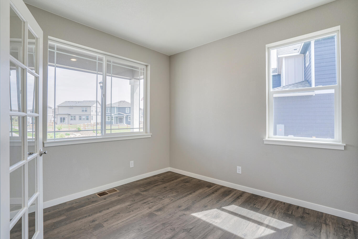 study with two windows and carpet