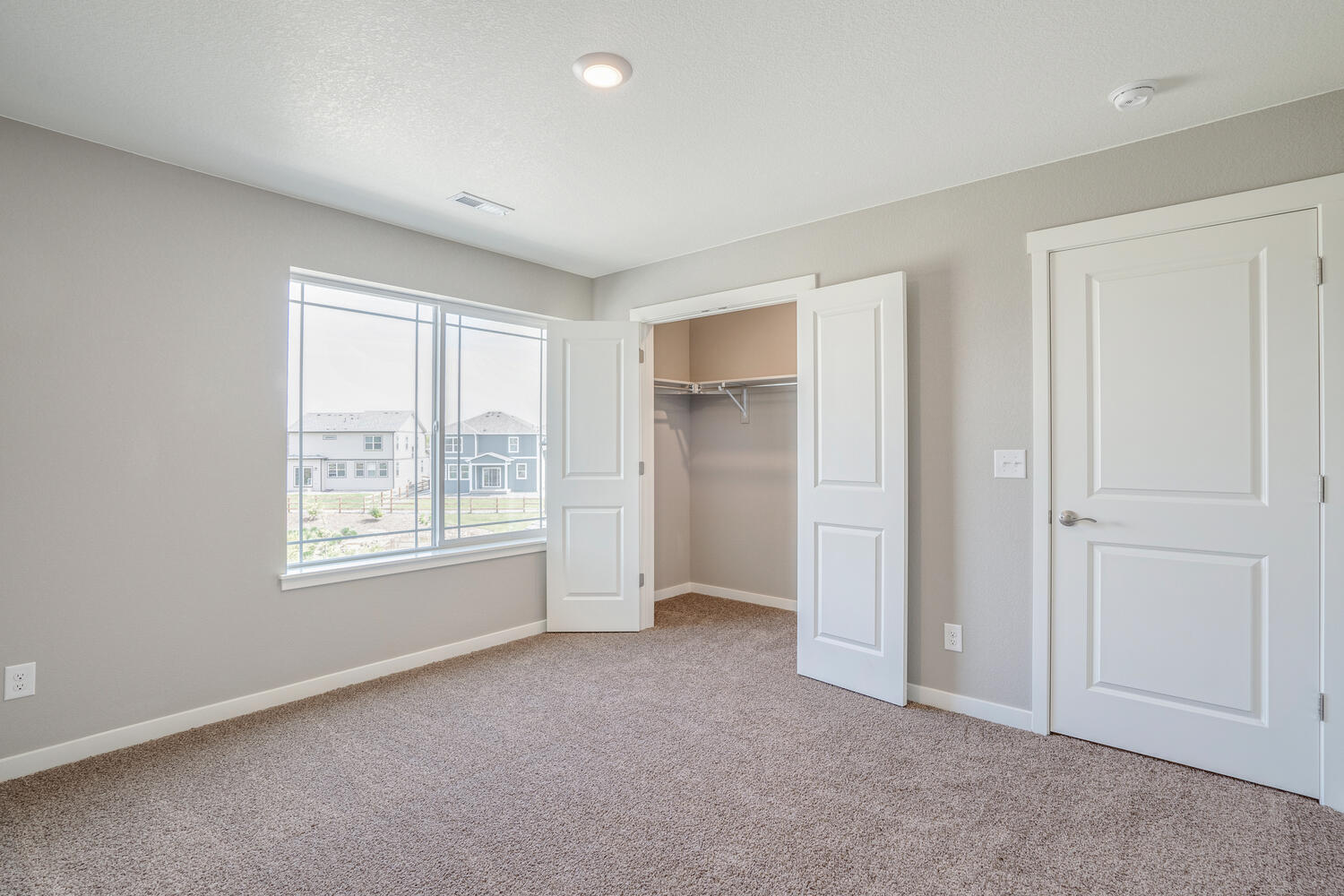 bedroom with a window and closet