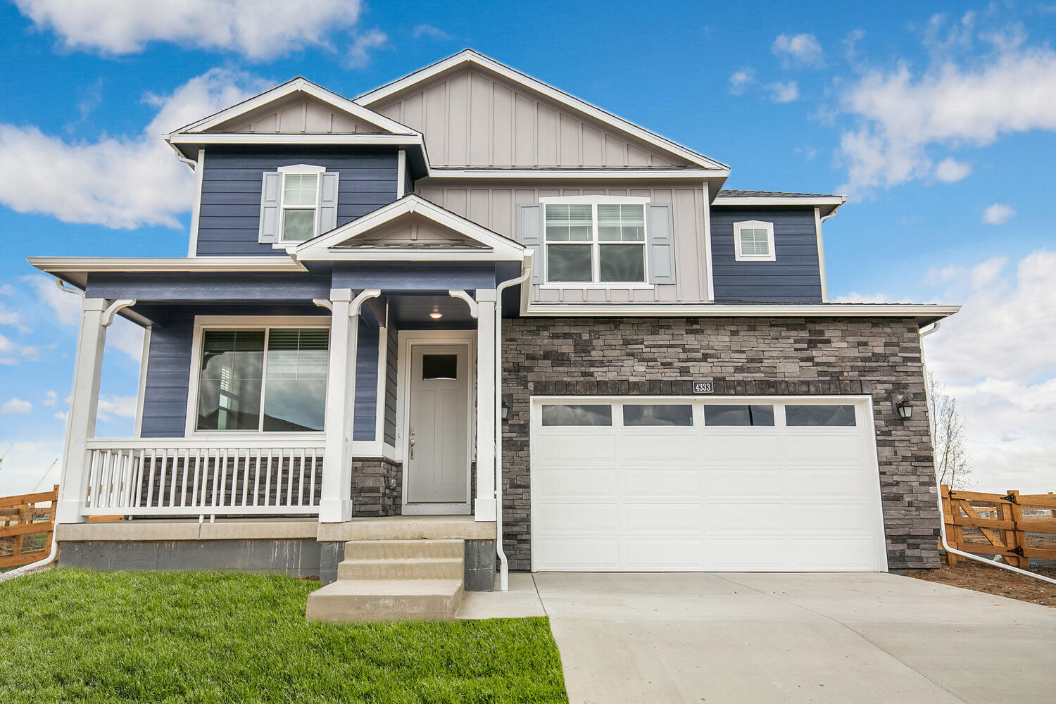 Calhan floorplan with two car garage interior photo with front yard landscaping