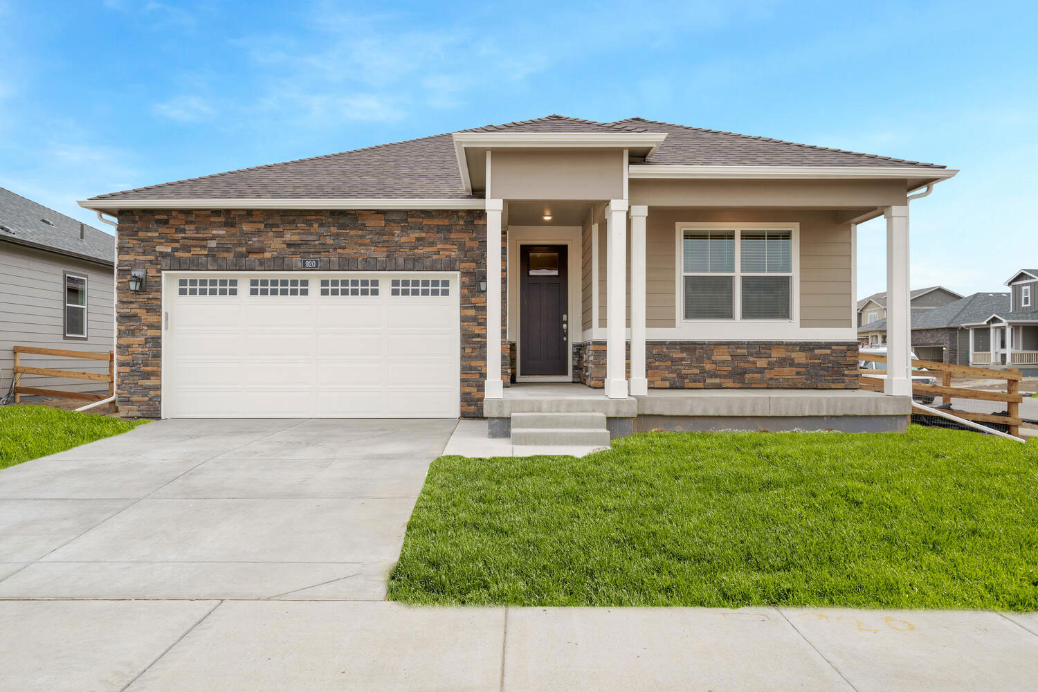 Avon floorplan with two car garage interior photo with front yard landscaping