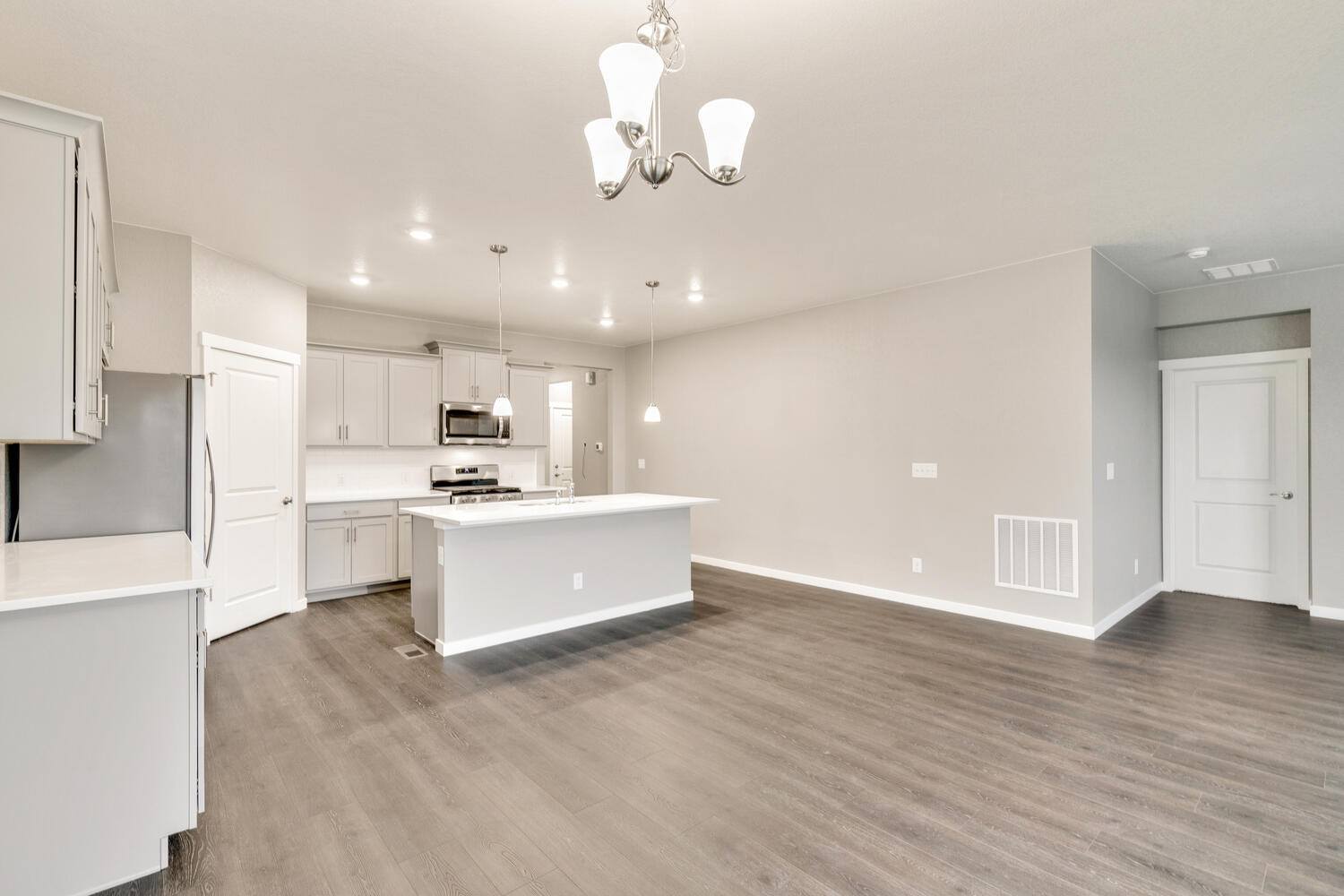 open space living room and  kitchen with hard wood floor
