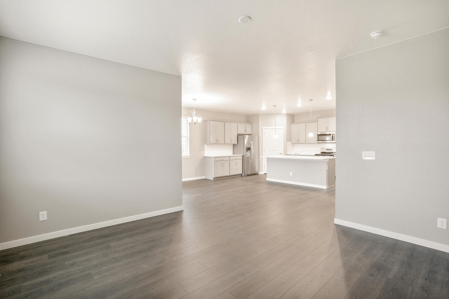 open space living room and  kitchen with hard wood floor