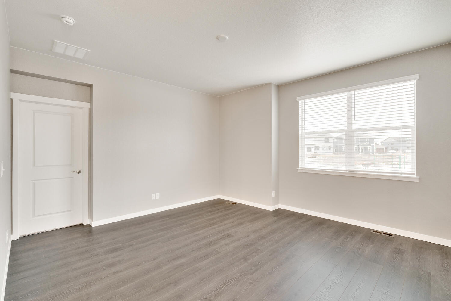 living room with a window and wood floor