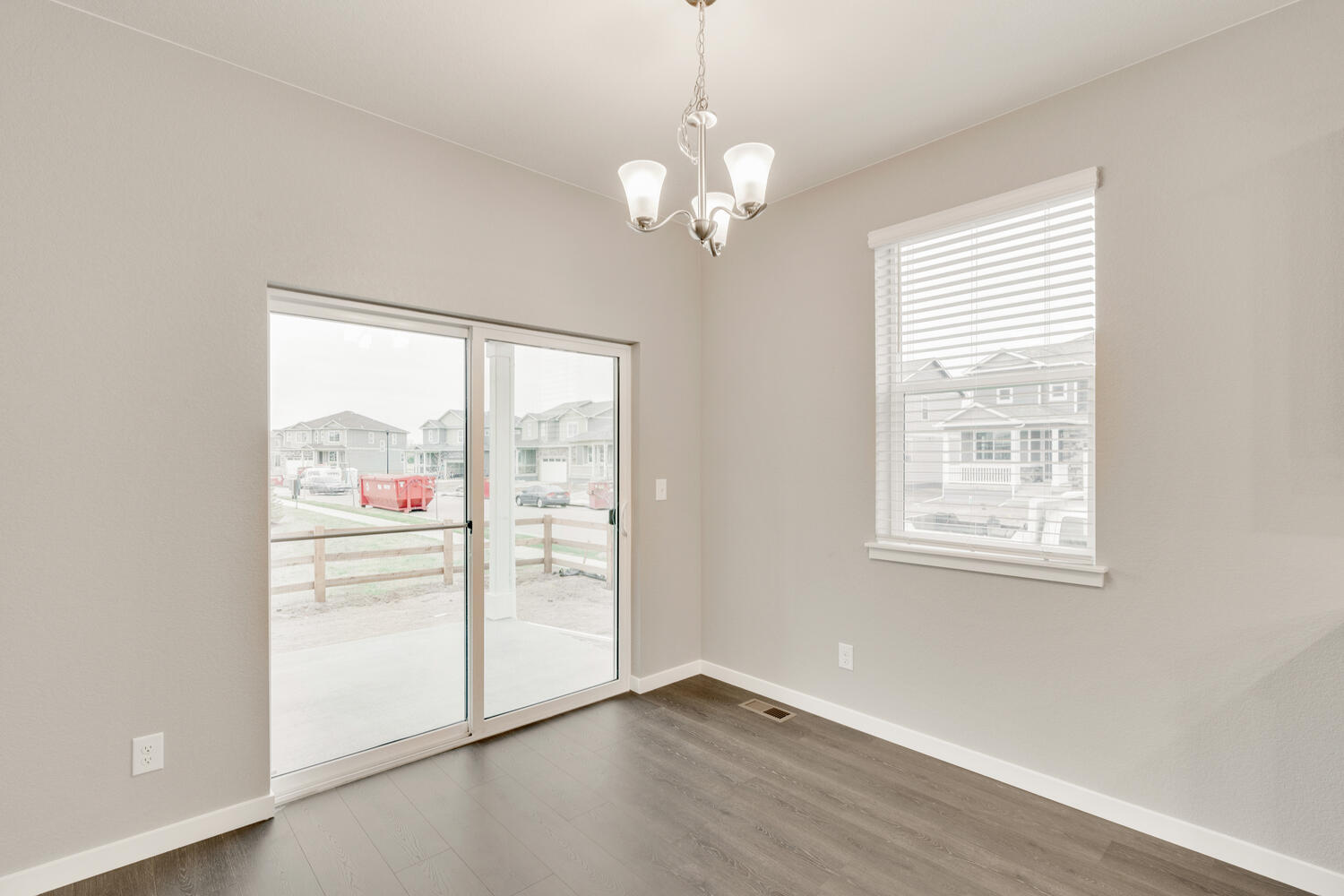 dining room with a back door, ceiling light  and a window