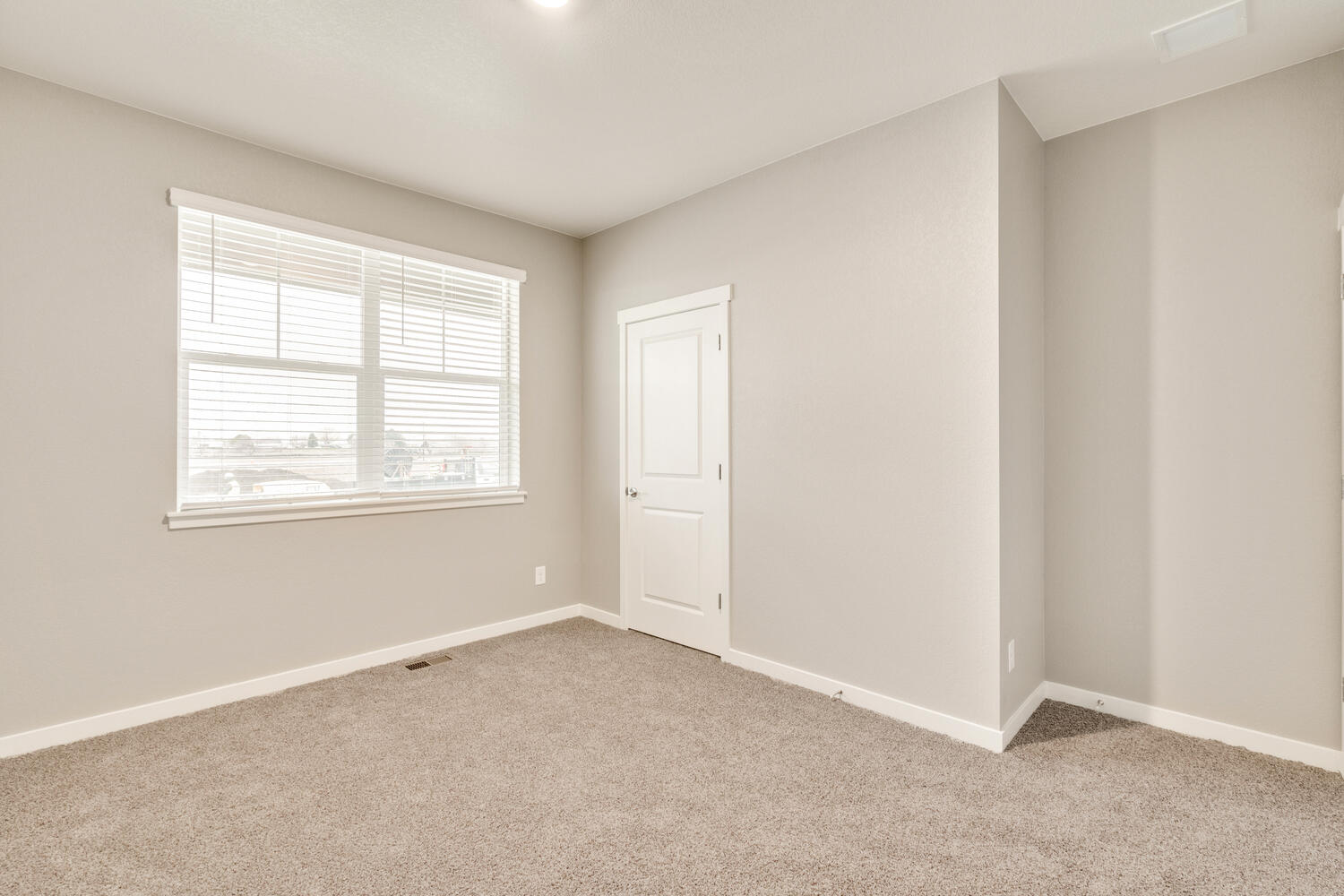 bedroom with a window and closet