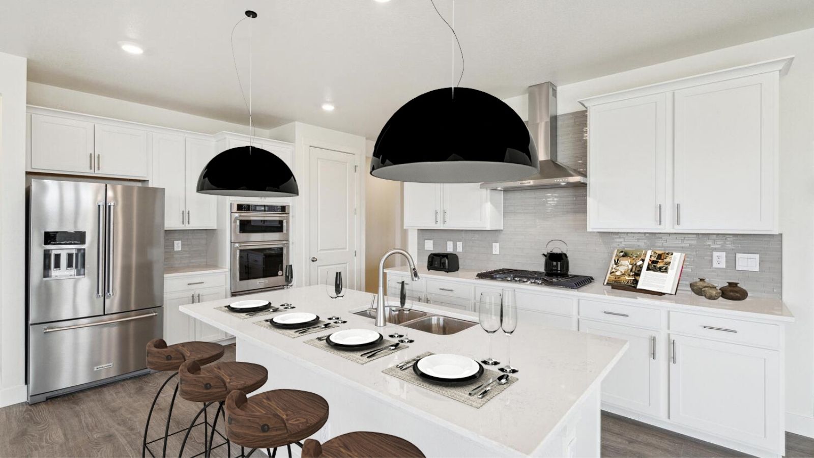 Kitchen with white cabinets in new D.R. Horton home in Berthoud, CO