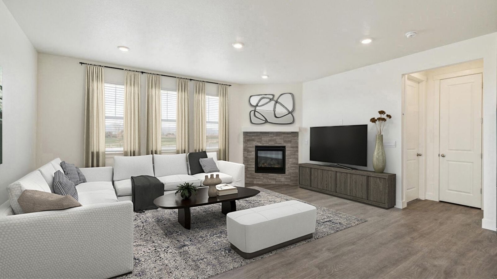 Living room with large windows in new home by D.R. Horton Berthoud, CO