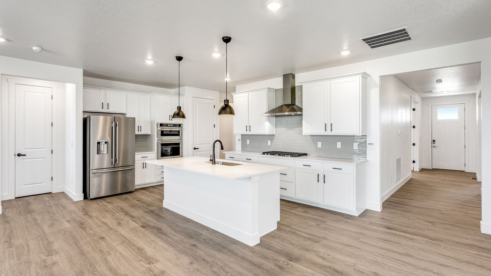 Open-concept Grover home at Vantage in Berthoud with 3 bedrooms, 2 bathrooms, modern finishes, and spacious living areas.