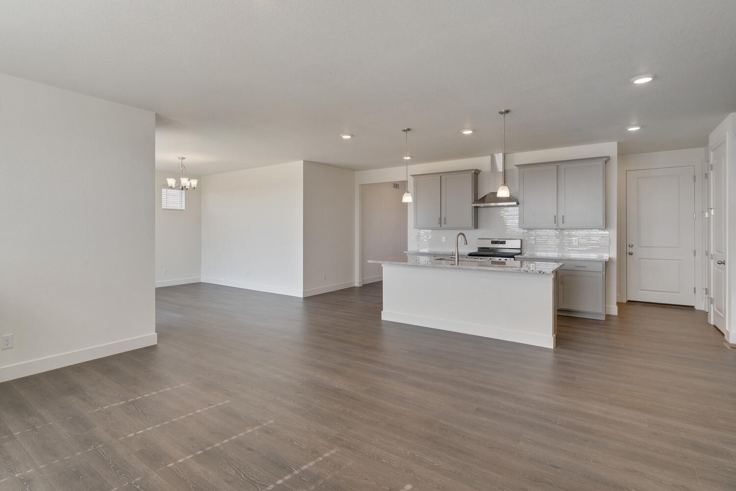gray cabinet kitchen with an island and stainless steel appliances