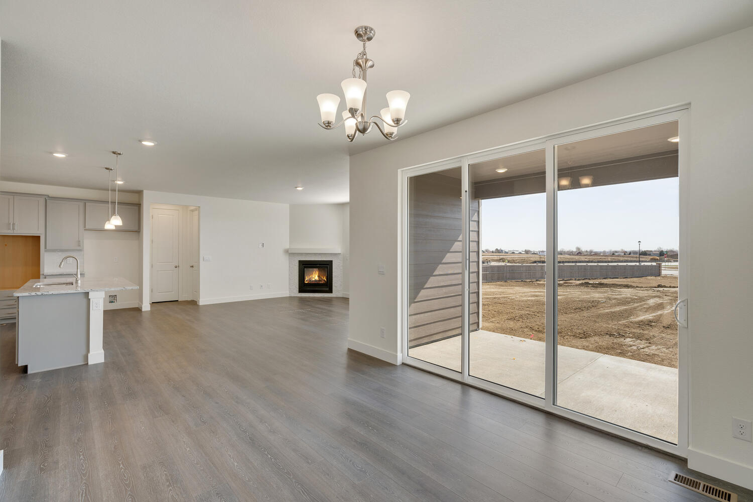dining room with a backdoor and kitchen view