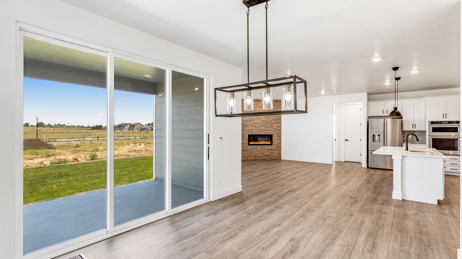 Open dining area in the Grover floor plan connected to the kitchen and great room for easy entertaining.