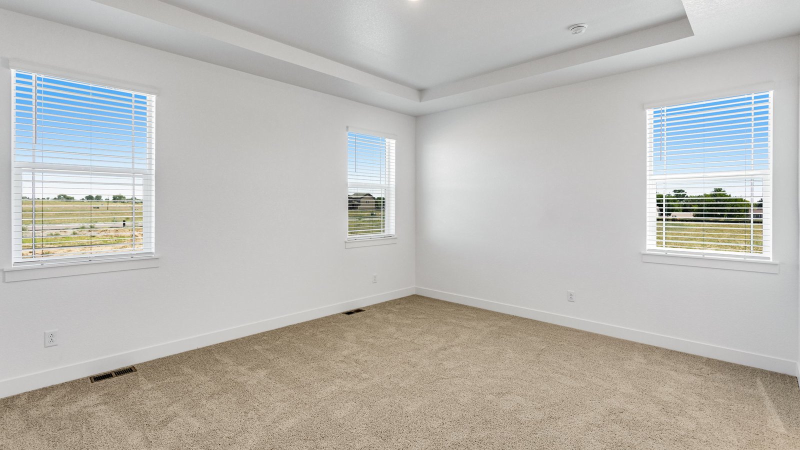 Private primary bedroom in the Grover floor plan featuring a spacious layout and relaxing retreat atmosphere.