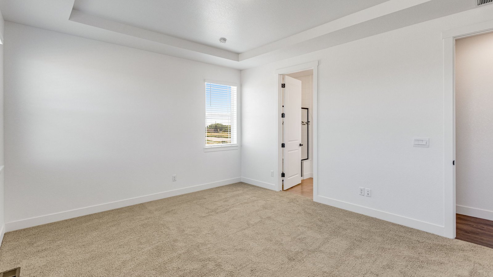 Owner’s suite in the Grover home with plenty of natural light and room for a king-sized bed.