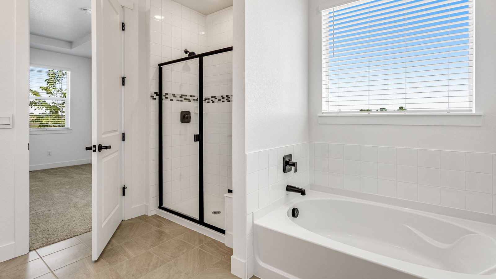 Spacious primary bathroom in the Grover home designed for comfort and daily convenience.