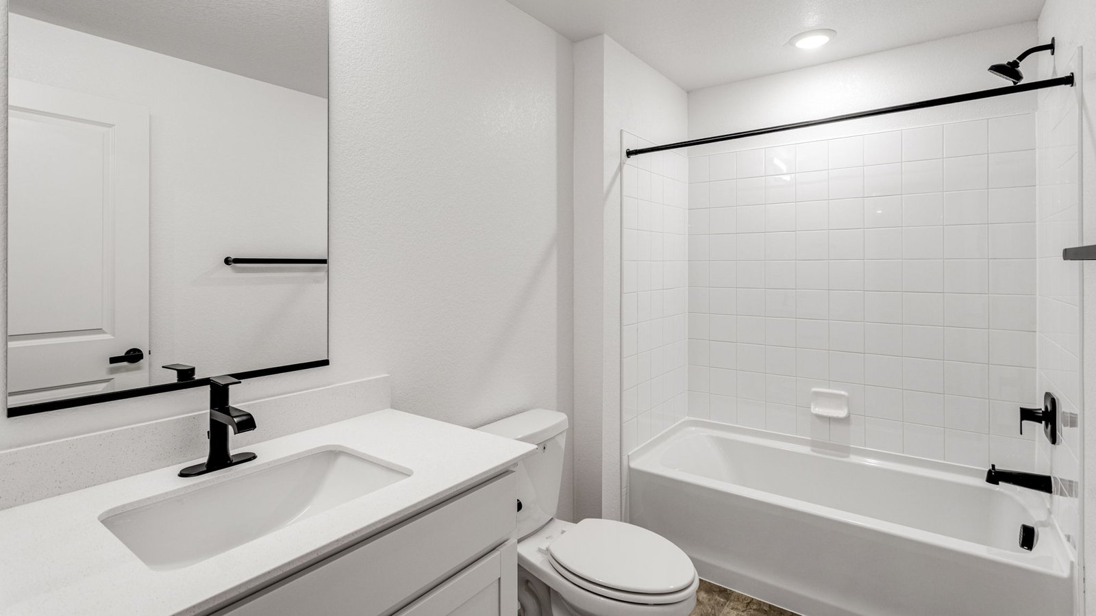 Well-appointed bathroom in the Grover floor plan with functional storage and modern finishes.