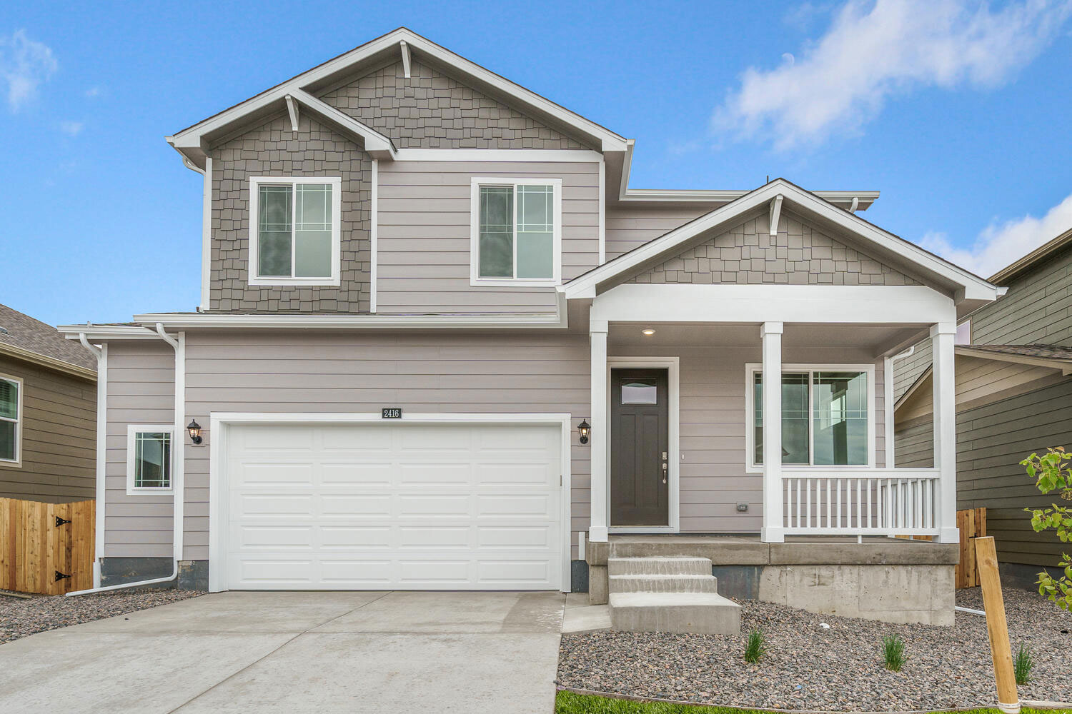 exterior photo of bellamy floorplan with two and half car garage with front yard landscaping