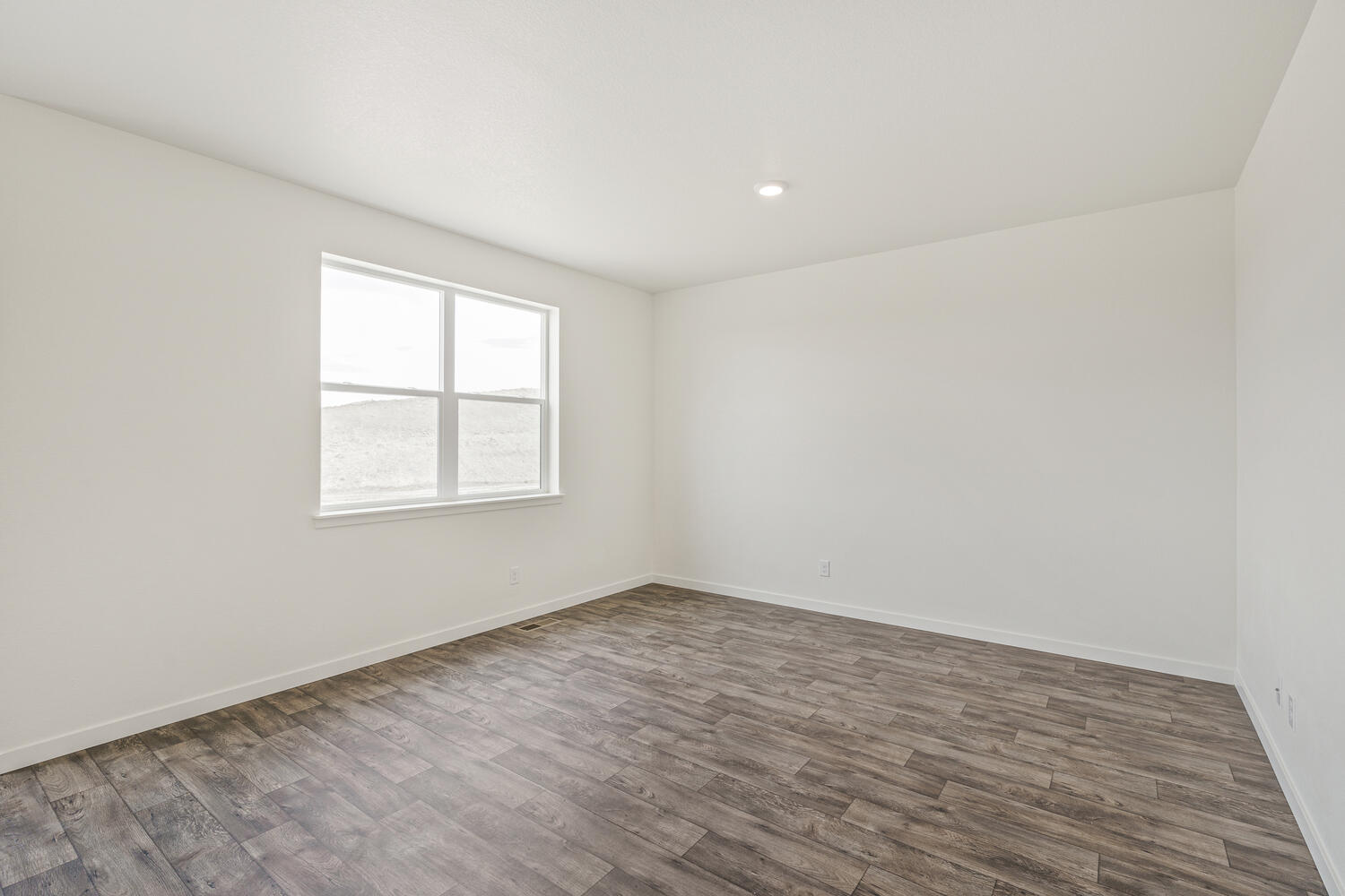 living room with a window and wood floor
