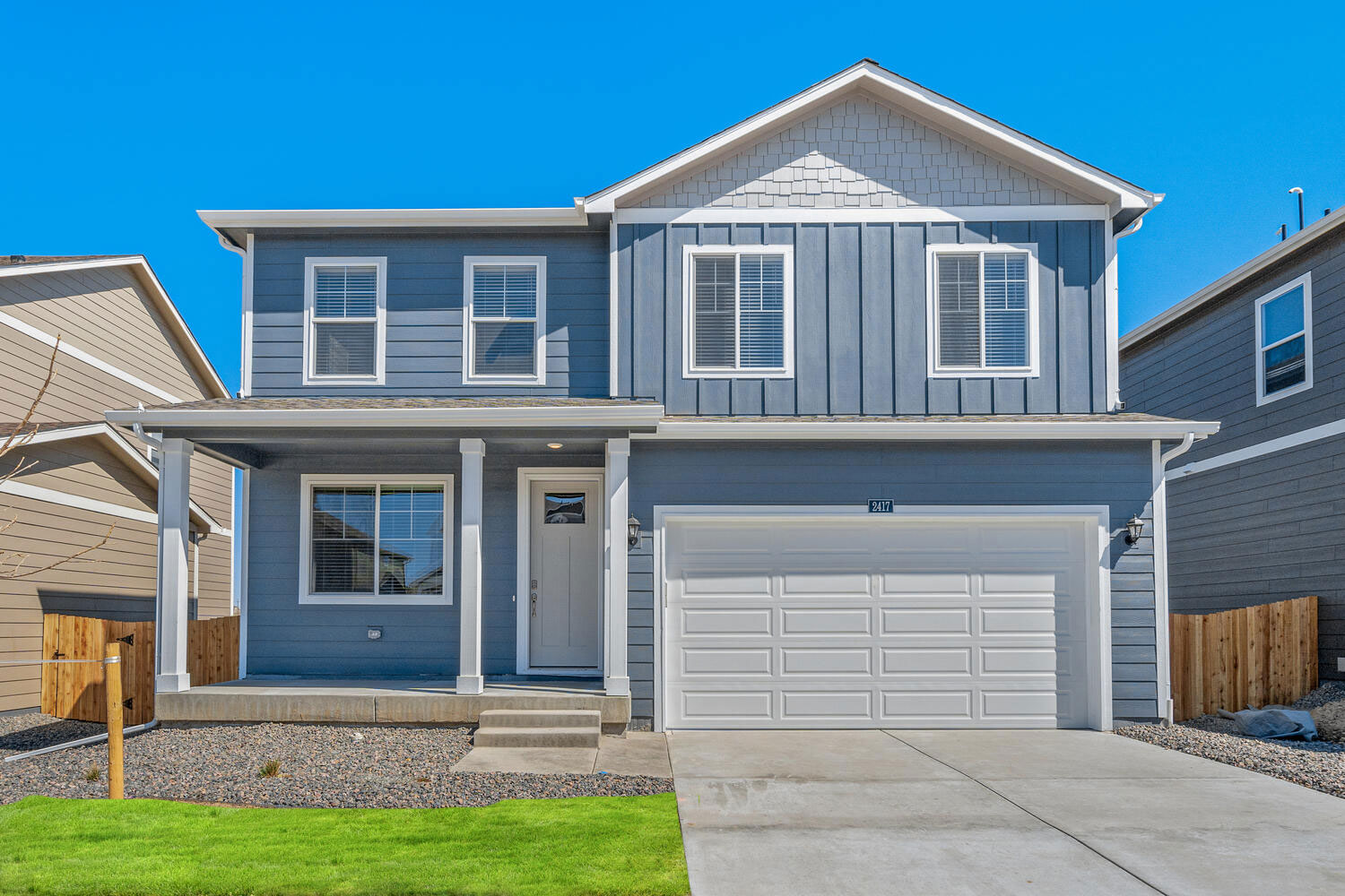 pendleton exterior photo with two car garage and front yard landscaping
