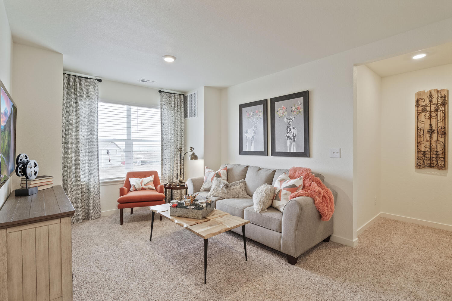 staged loft with a window, ceiling light and carpet floor