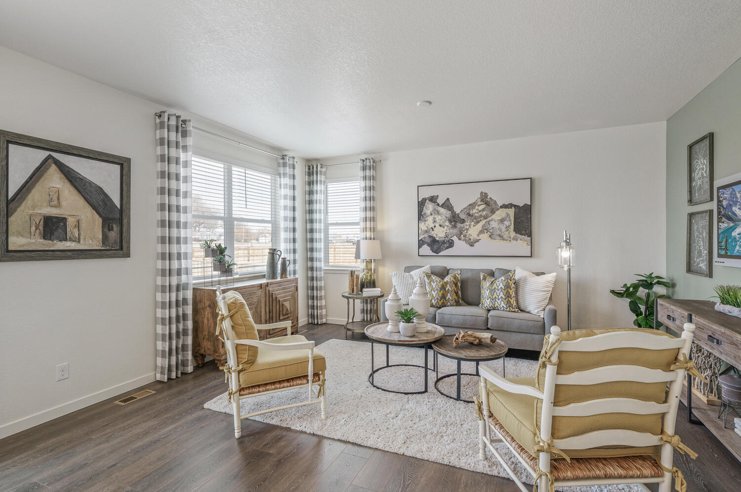 living room with two windows and wood floor