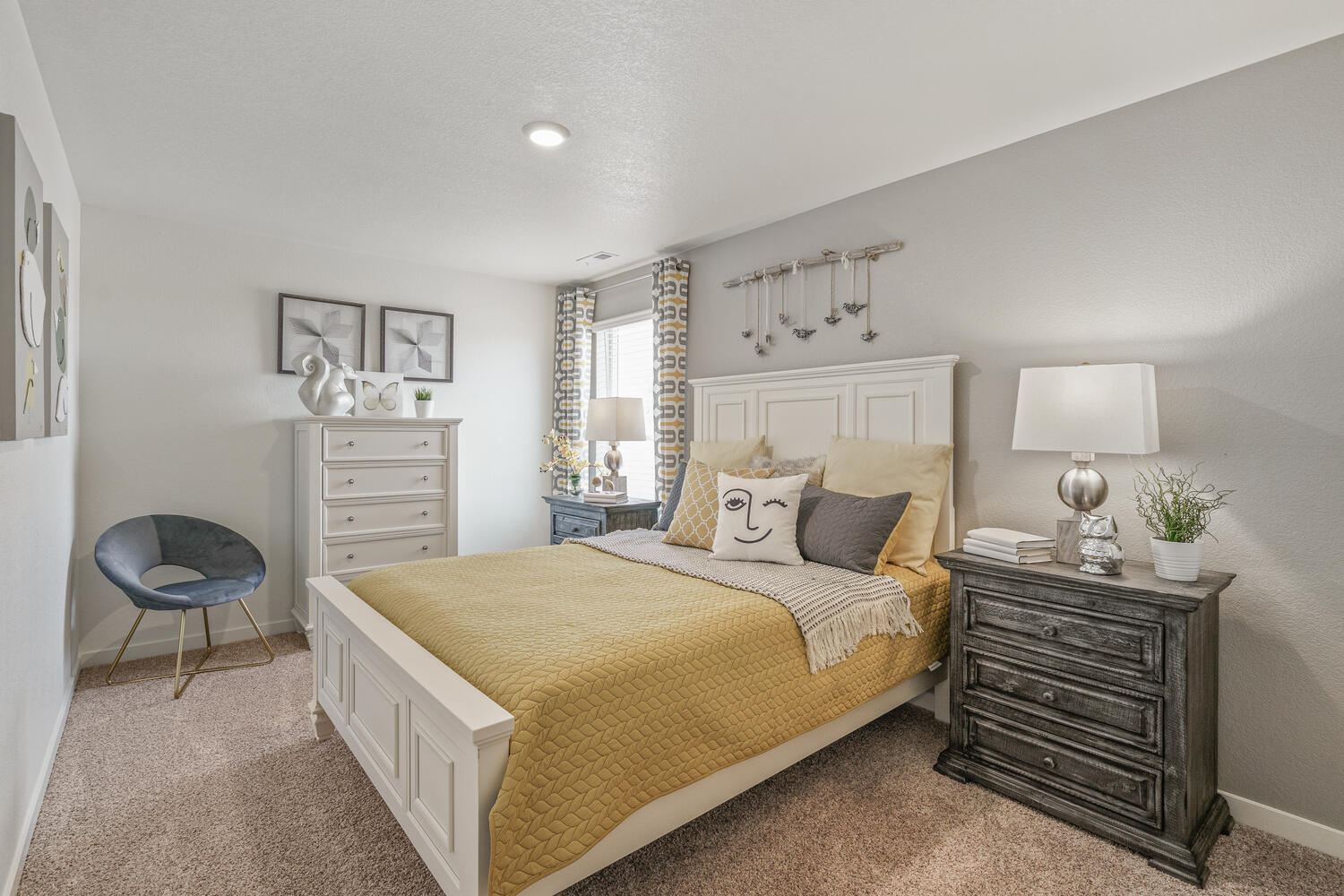 staged bedroom with carpet floor and a window