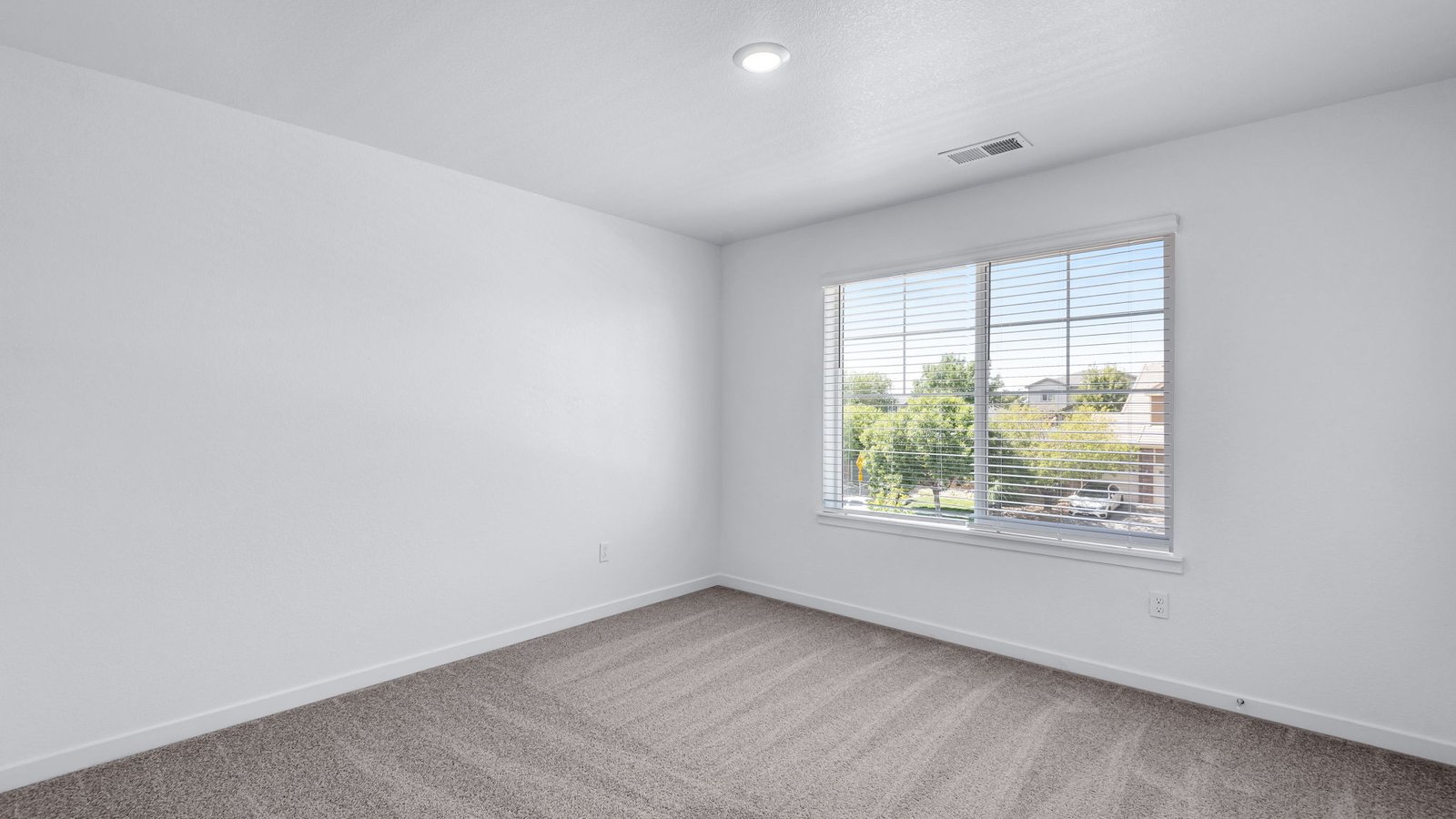 Secondary bedroom with large windows in new home at Brighton Crossing