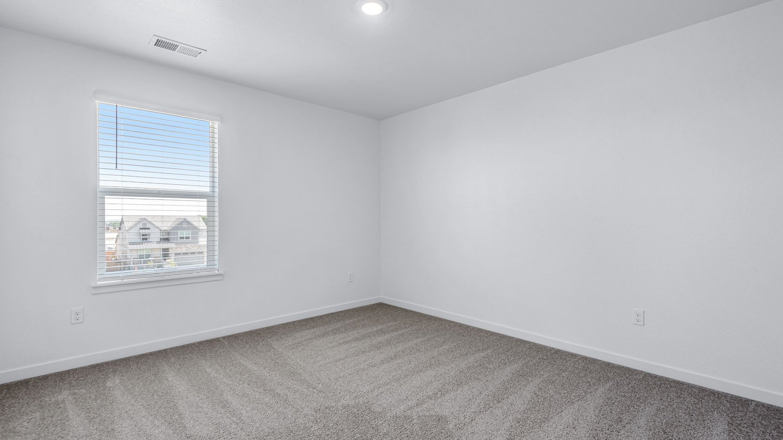 Secondary bedroom with large windows in new home at Brighton Crossing