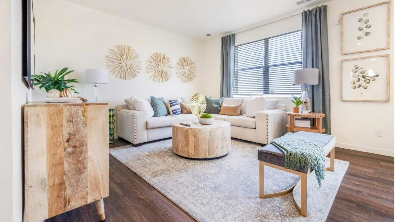 Living room with large windows in new home at Brighton Crossing Community
