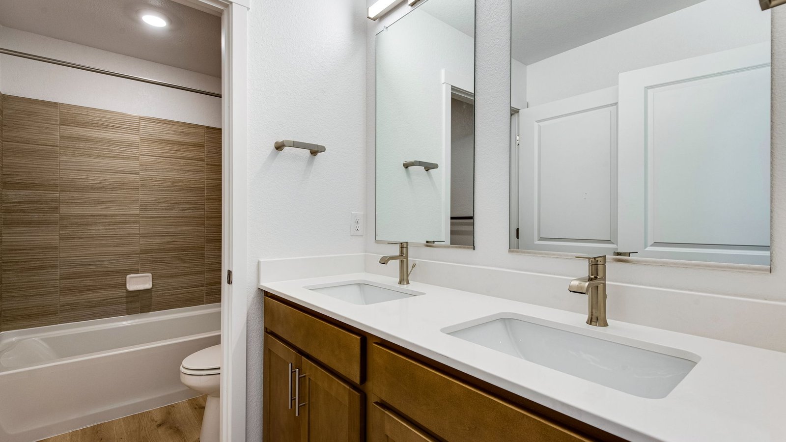 Secondary bathroom with dual vanity sinks and new finishes in Brighton Colorado new home