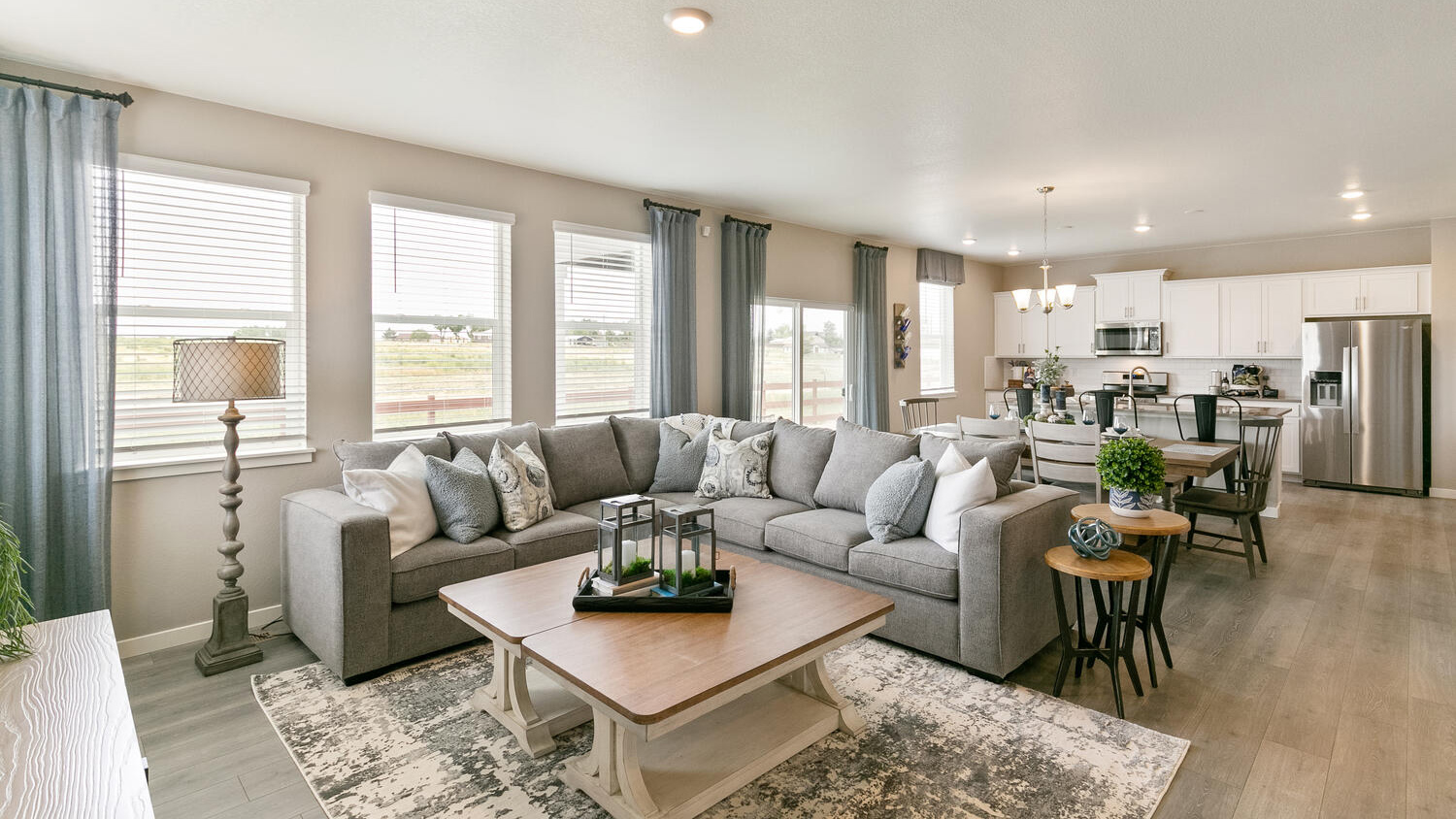 Open concept layout with large windows in new home at Brighton Crossing Community