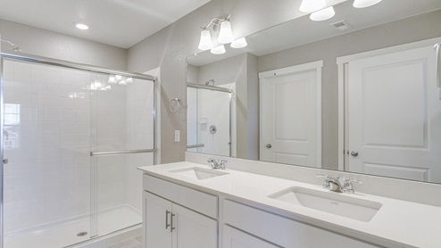 white cabinet bathroom with a shower