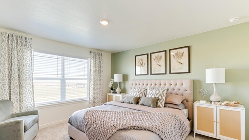 Primary bedroom in model home at Revere at Johnstown community by D.R. Horton in Johnstown, CO
