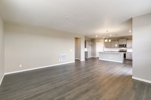 open space living room and  kitchen with hard wood floor