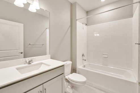 light gray bathroom with a tub