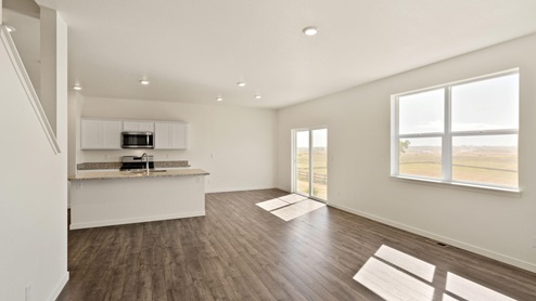 Henley Living Room into Kitchen at Trails at Crowfoot by D.R. Horton