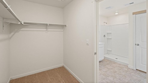 Henley Primary Bedroom walk in Closet at Trails at Crowfoot by D.R. Horton