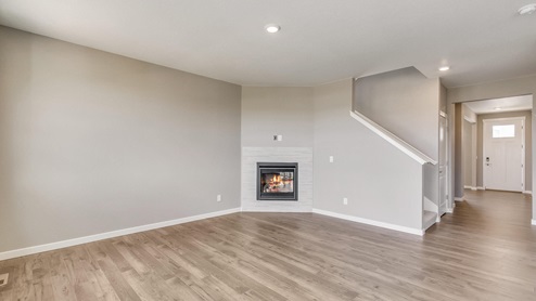 Bridgeport Living Room with Fireplace at Trails at Crowfoot by D.R. Horton