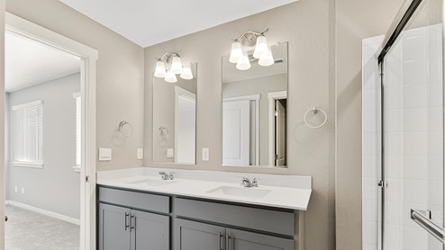 main bathroom with grey cabinets