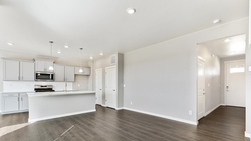 grey cabinet kitchen with hallway view
