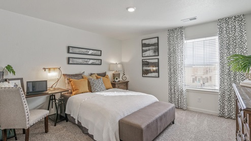 staged bedroom with  one windows and carpet flooring