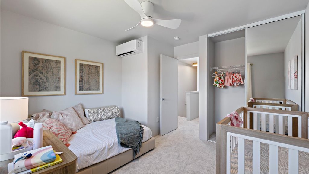 Interior secondary bedroom with sliding door closet