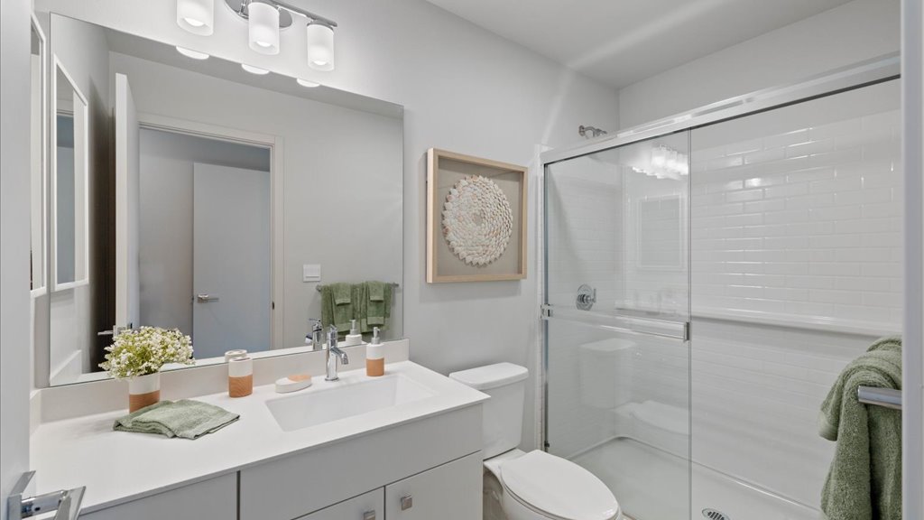 Interior bathroom with toilet vanity and walk in shower