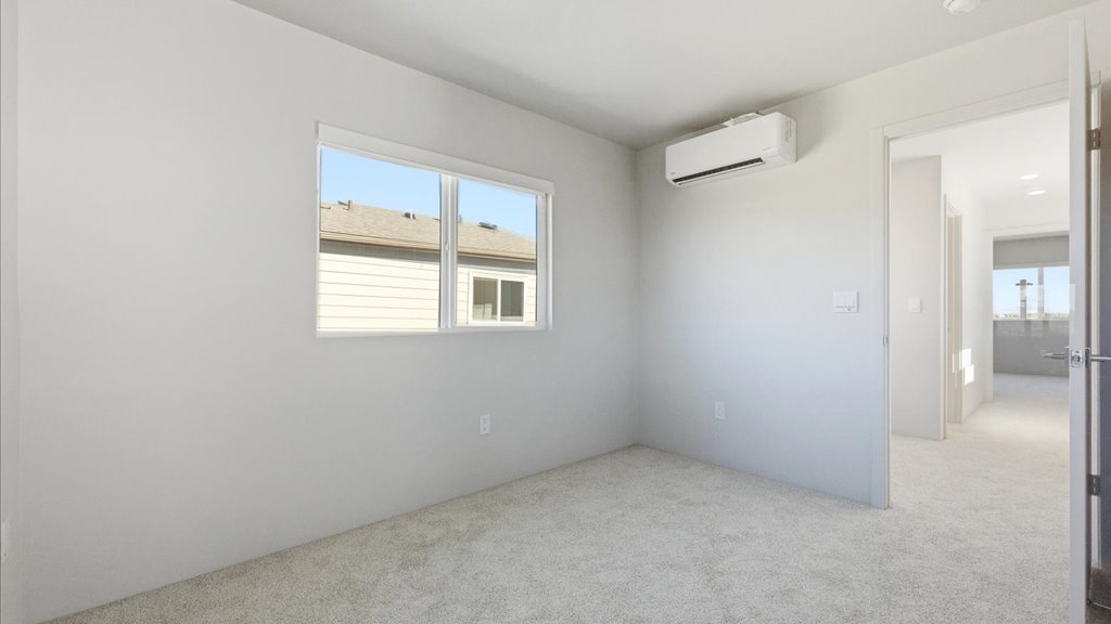 Interior bedroom with large window and sliding door closet