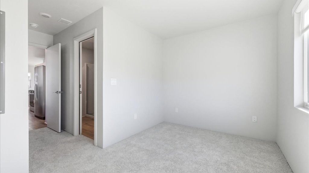 Interior bedroom open to bathroom
