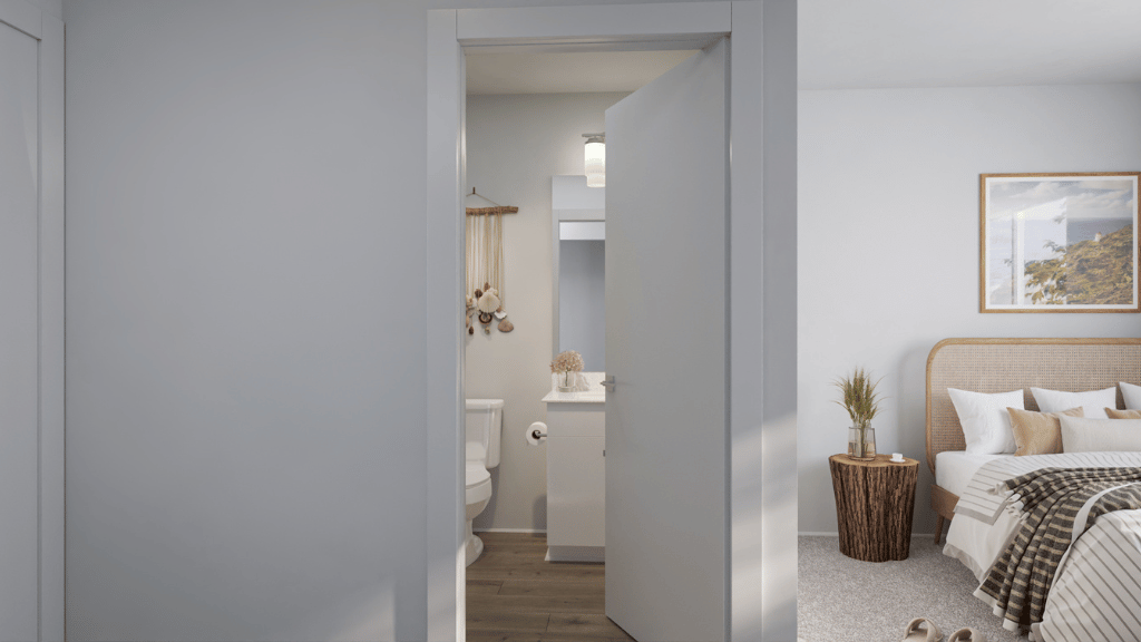 Interior primary bedroom open to bathroom