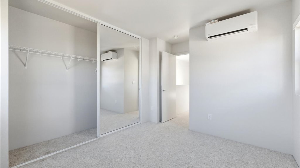Interior bedroom with sliding closet doors