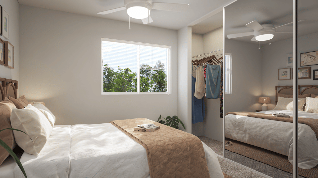 Interior bedroom with large window and sliding door closet