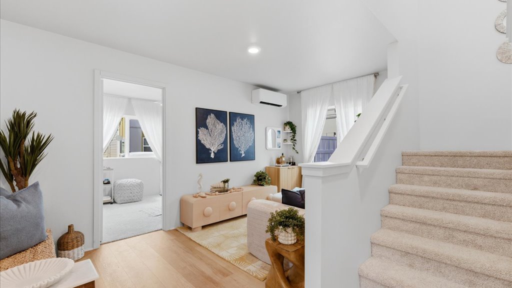 Interior bonus space with large window open to stairs